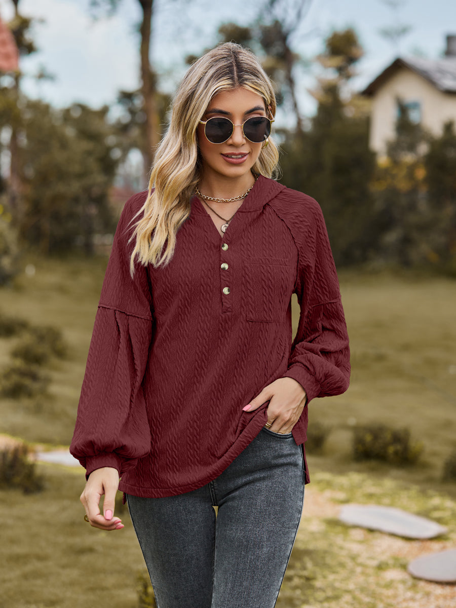 Textured knit henley in wine with balloon sleeves and button detail