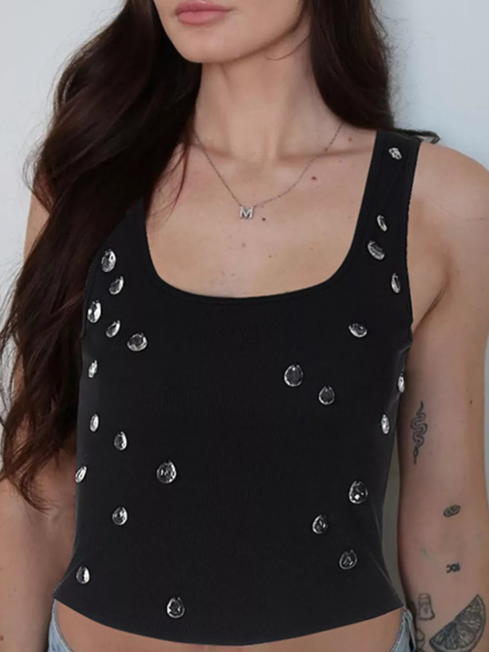 Black cropped tank top with scattered rhinestone embellishments and square neckline.