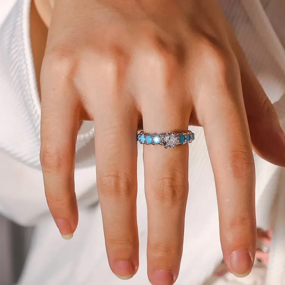 Sterling silver ring with turquoise bezel and solitaire diamond accent