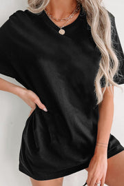 Black oversized slouch tee dress with short sleeves and a relaxed fit.