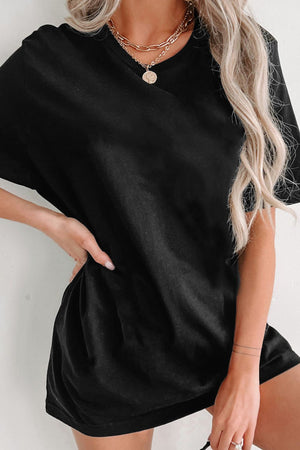 Black oversized slouch tee dress with short sleeves and a relaxed fit.