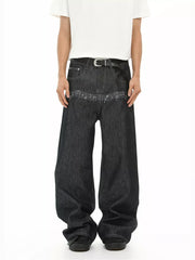 Loose fit dark wash denim jeans with embroidered musical notes detail.