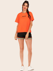 Orange t-shirt with black "SOLD OUT" graphic, crew neck, short sleeves.