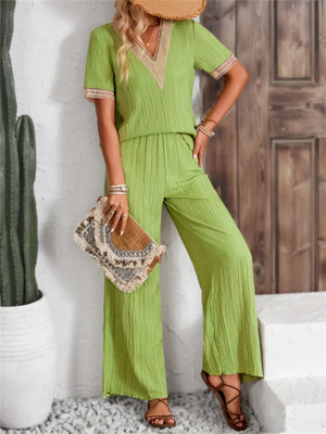 Lime crinkle knit v-neck co-ord set with lace trim and wide leg pants.