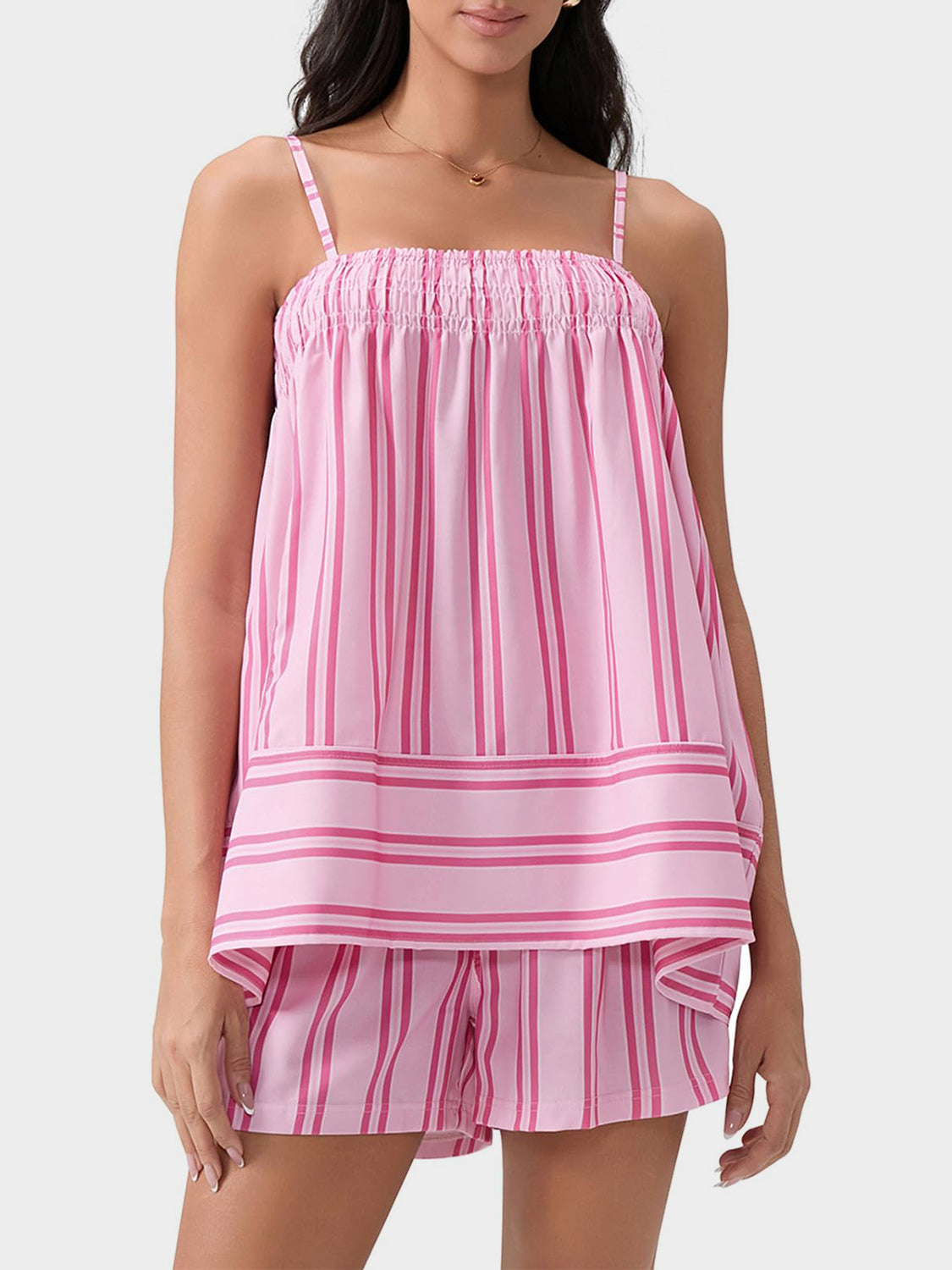 Pink striped cami and shorts set with smocked neckline and banded hem.