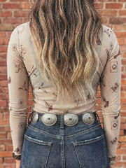 Sheer mesh mock neck shirt with western print and long sleeves.