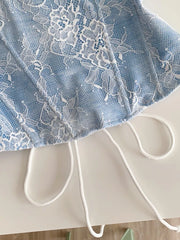 Blue lace tube top with white floral overlay and adjustable drawstring detail