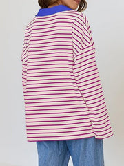 Oversized striped long-sleeve sweatshirt in cream with magenta stripes and a blue collar.