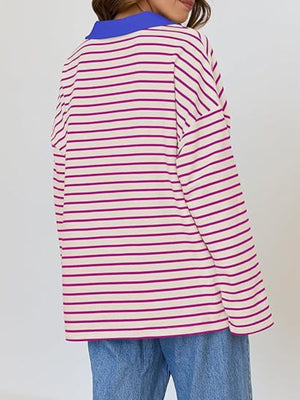 Oversized striped long-sleeve sweatshirt in cream with magenta stripes and a blue collar.