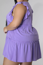 Lavender tiered ruffle babydoll mini dress with ruffled tiers.
