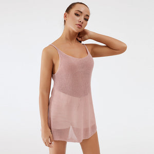Dusty pink ribbed knit cami dress with scoop neck and thin straps.