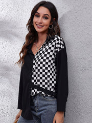 Checkerboard panel button-down blouse in black and white polyester with a collared neckline.