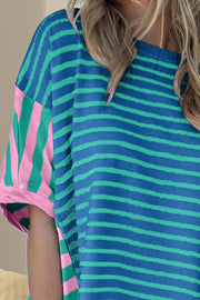 Asymmetric stripe panel tee in cerulean with pink and green stripes on sleeve