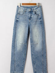 Vintage-inspired high-waisted seam jeans in light wash denim with cuffed hems.