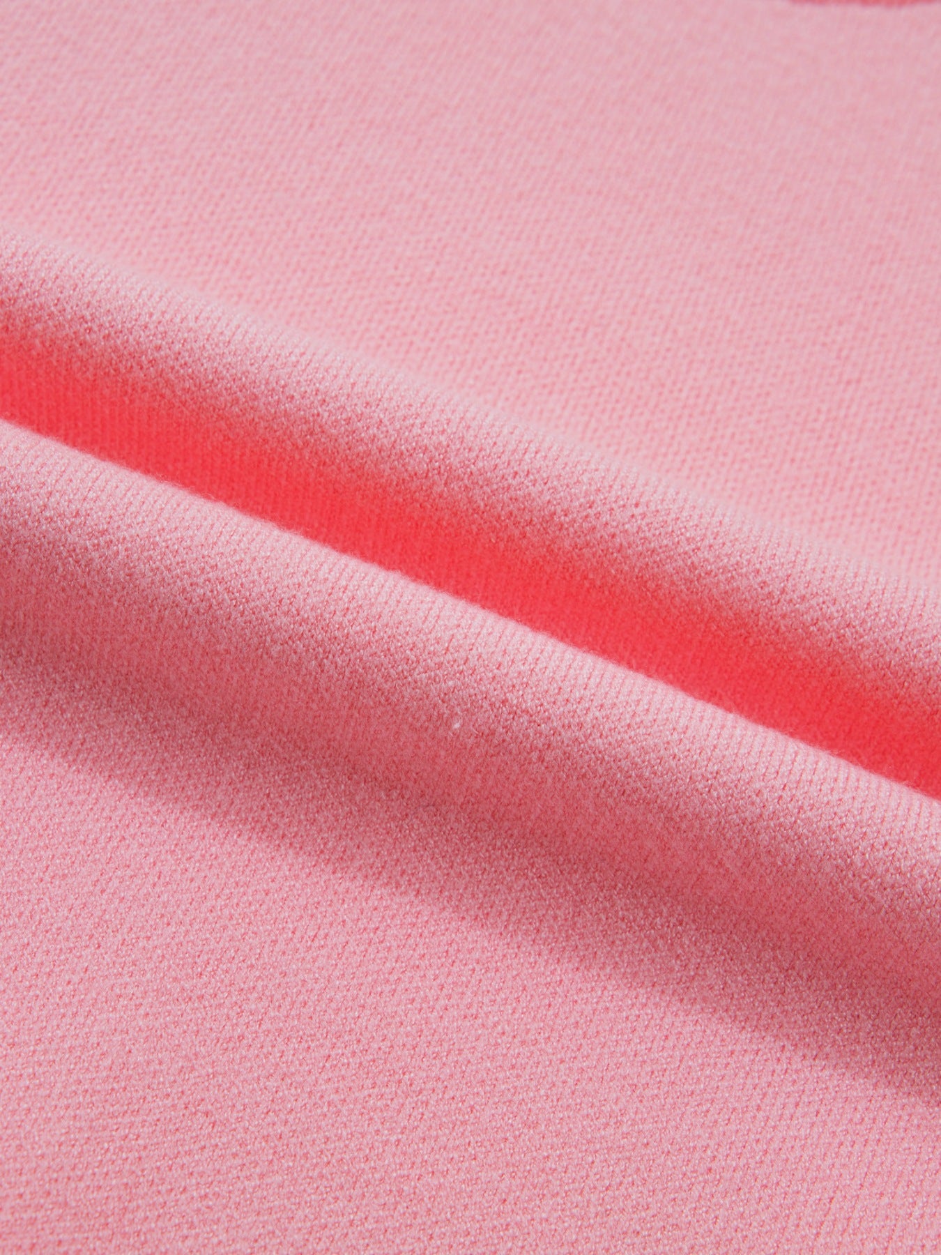 Pink knit sweater with scalloped hem detail