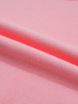 Pink knit sweater with scalloped hem detail