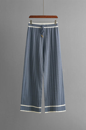 Dusty blue ribbed knit loungewear pants with contrast trim and drawstring waist.