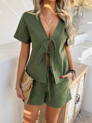 Moss linen tie-front top and shorts set with short sleeves and v-neckline.