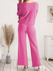 Pink acrylic wide-leg loungewear set with a relaxed fit and crew neck top.