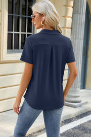 Dark Blue textured polo shirt with V-neck detail and short sleeves.