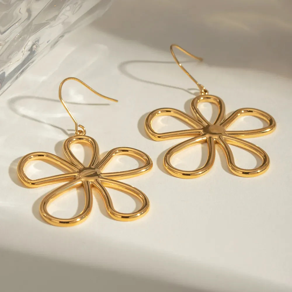 Gold sculpted petal drop earrings with 18K gold plating.