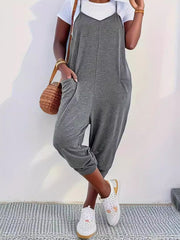 Heathered dark gray loose fit spaghetti strap jumpsuit with pockets and cropped legs.