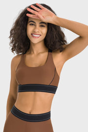 Chocolate sports bra with black band and white stitching detail