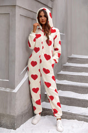 Heart-print sherpa onesie with hood and pockets, cream with red hearts