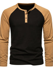 Men's long sleeve black henley t-shirt with tan raglan sleeves and button placket.