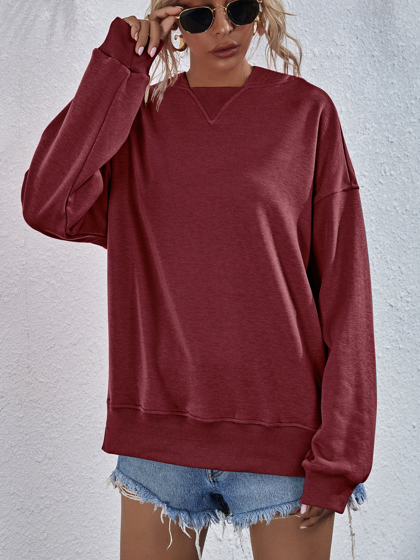 Brick Red sweatshirt with V-neck detail and ribbed cuffs and hem.
