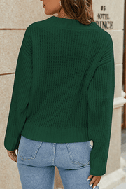 Dark green knit v-neck pullover sweater with a relaxed fit and subtle open knit detail.