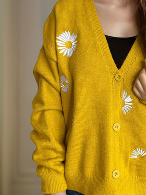 Mustard yellow oversized knit cardigan with embroidered daisies and buttons