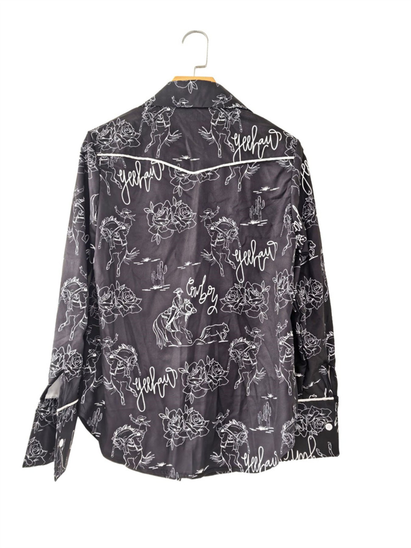 Black long sleeve button up shirt with rodeo print, roses, cacti and yeehaw text.