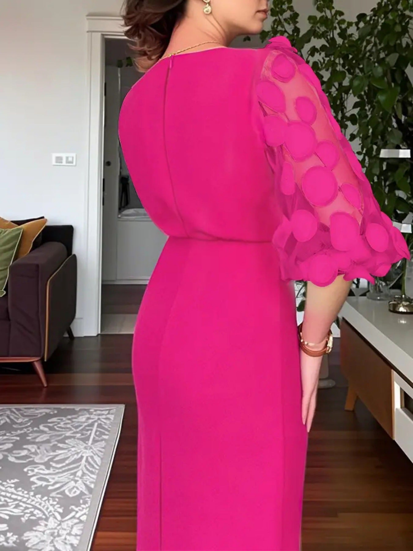 Rose red midi dress with sheer polka dot appliqué sleeves and a fitted silhouette.