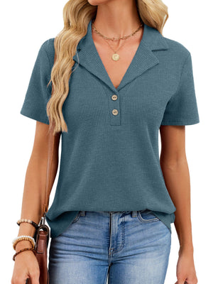 Peacock blue waffle knit polo shirt with button placket and collared neckline.