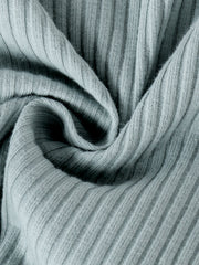 Green ribbed knit fabric detail