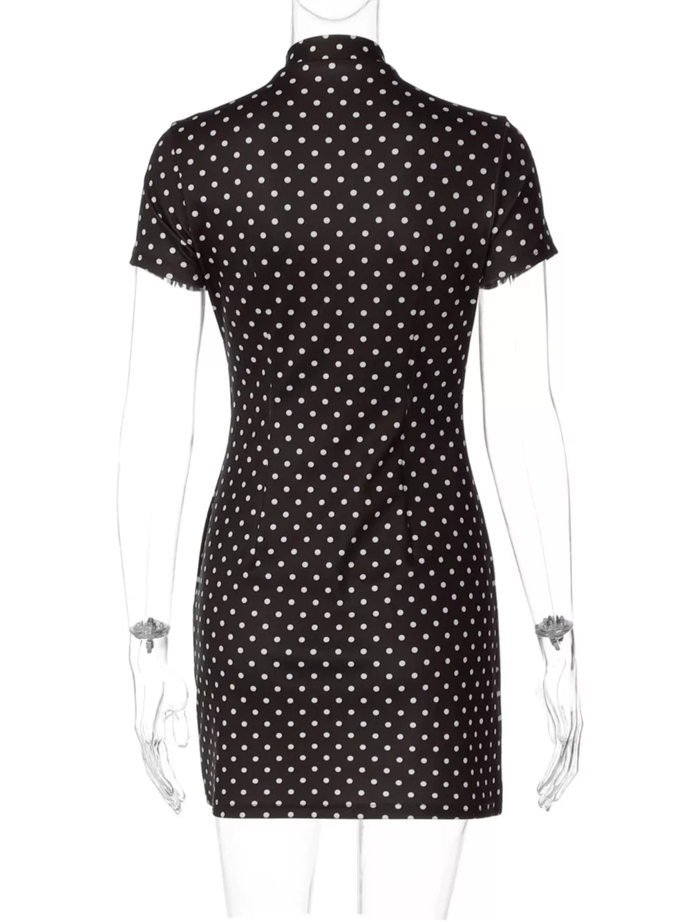Black polka dot mini dress with short sleeves and a mock neck.