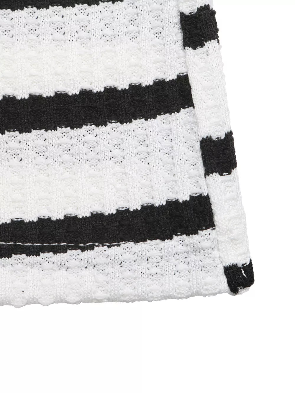 Sleek striped bodycon midi dress in black and white knit with textured detail.