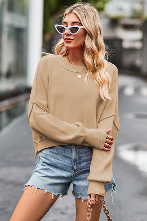 Caramel ribbed knit batwing sweater with crewneck and cropped length.