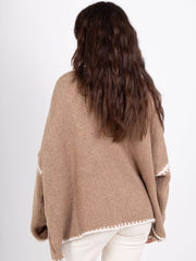 Camel oversized cardigan with contrast white trim and knit detail.
