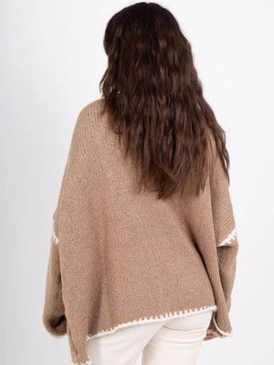 Camel oversized cardigan with contrast white trim and knit detail.