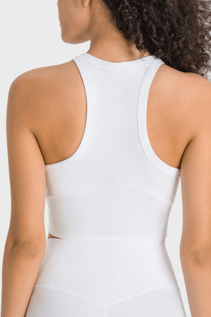 White activewear crop top with racerback and sculpted neckline detail
