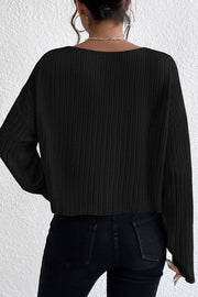 Black ribbed knit off-shoulder top with long sleeves and a cropped hem.