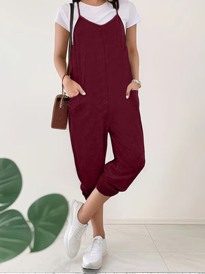 Burgundy heathered loose fit spaghetti strap jumpsuit with pockets and cropped legs.