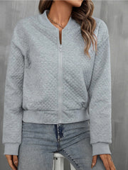 Gray diamond quilted bomber jacket with zip front and ribbed cuffs.