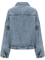 Light wash oversized denim jacket with buttoned cuffs and patch pocket detail.
