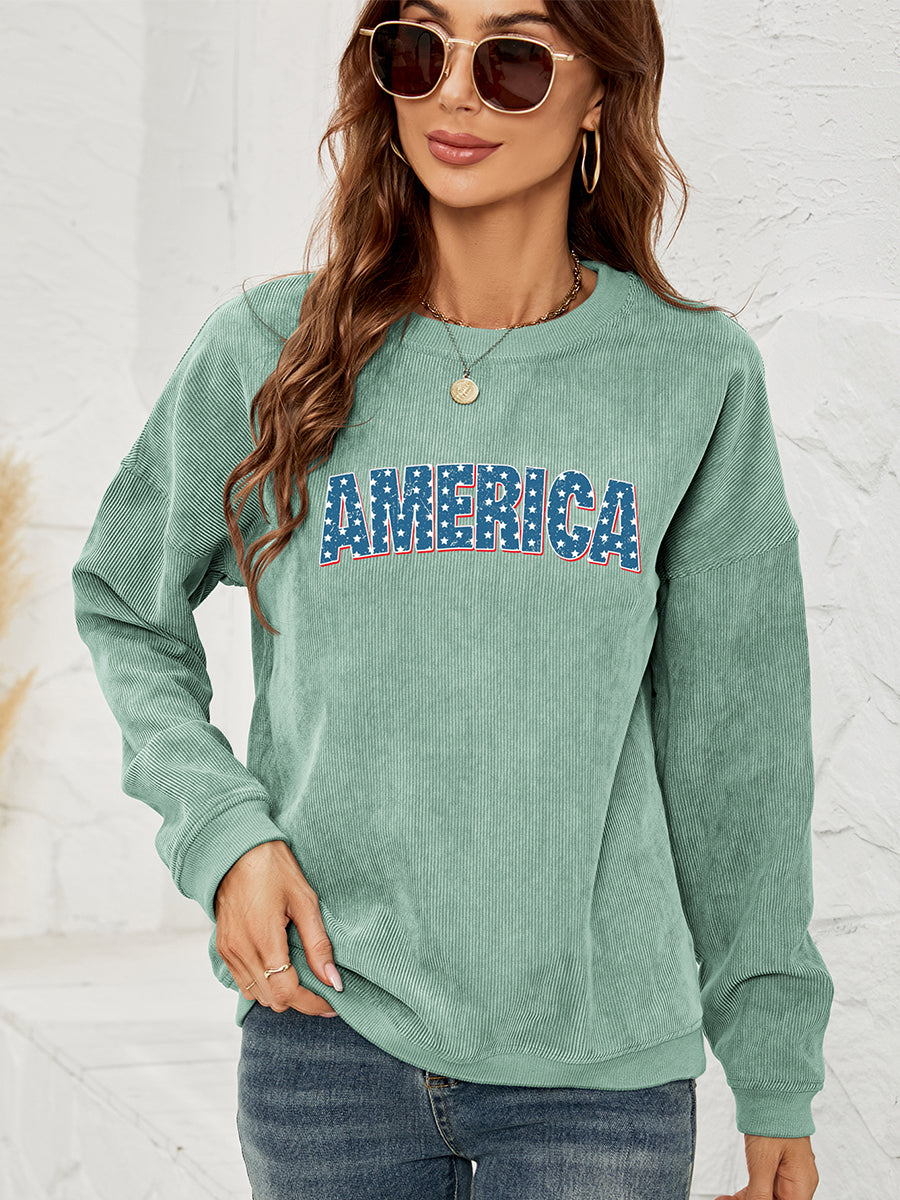 Corduroy sweatshirt in Gum Leaf with "AMERICA" graphic, crewneck, long sleeves.