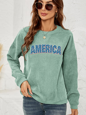 Corduroy sweatshirt in Gum Leaf with "AMERICA" graphic, crewneck, long sleeves.