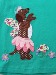 Toddler dress with embroidered brown polka dot dog design, floral wings, and pink petal skirt.