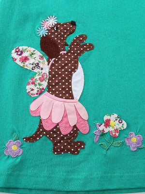 Toddler dress with embroidered brown polka dot dog design, floral wings, and pink petal skirt.
